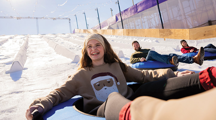 Girl tubing at Christmas at Kentucky Kingdom in Louisville, Kentucky (photo courtesy of Kentucky Kingdom)