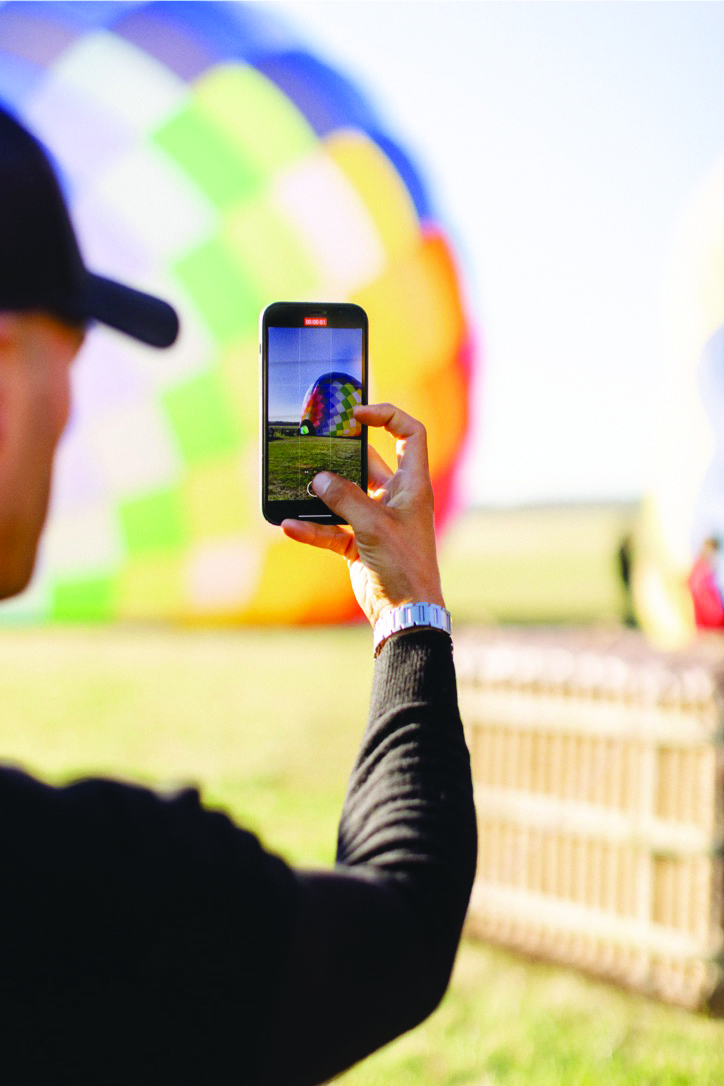 Man takes photo of hot air balloon in Bloomington, Indiana (photo courtesy of SkyVista Ballooning) Man takes photo of hot air balloon in Bloomington, Indiana (photo courtesy of SkyVista Ballooning)