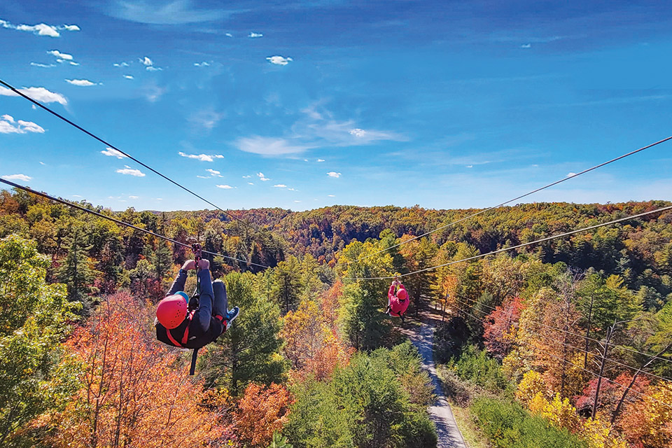 People zip lining at Red River Gorge Ziplines in Campton, Kentucky (photo courtesy of Red River Gorge Ziplines) People zip lining at Red River Gorge Ziplines in Campton, Kentucky (photo courtesy of Red River Gorge Ziplines)