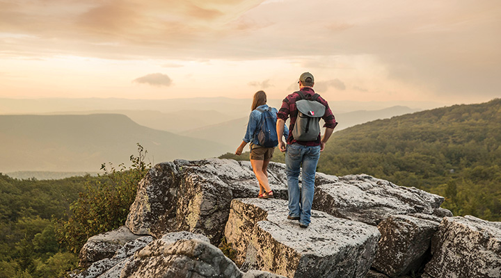 People hiking on rock overlooking mountains in Dolly Sods Wilderness in Davis, West Virginia (photo courtesy of West Virginia Department of Tourism) People hiking on rock overlooking mountains in Dolly Sods Wilderness in Davis, West Virginia (photo courtesy of West Virginia Department of Tourism)